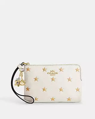 COACH Boxed Corner Zip Wristlet With Star Print And Charms